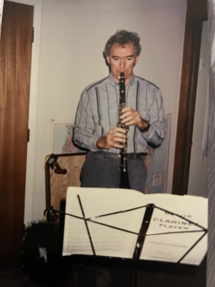 My dad standing at a music stand, playing clarinet